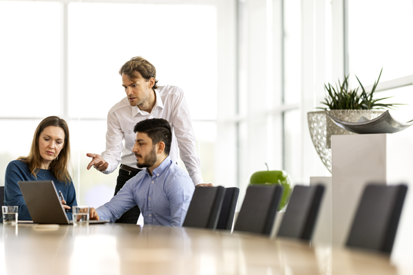 Work at conference table men and woman
